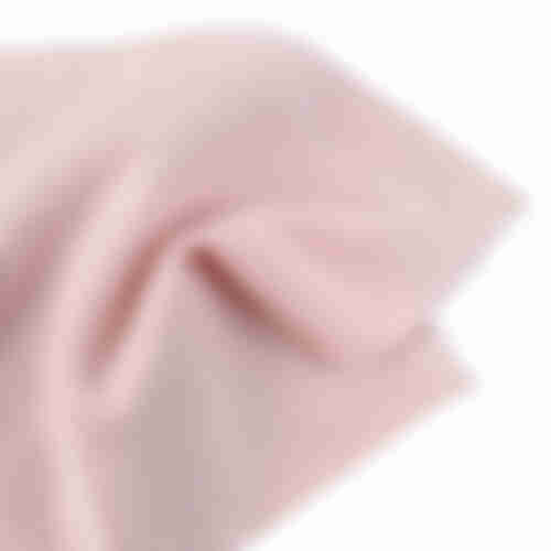Close-up of light pink terry fabric swatch showing soft texture and scalloped edge, ideal for a cotton polyester hoodie.