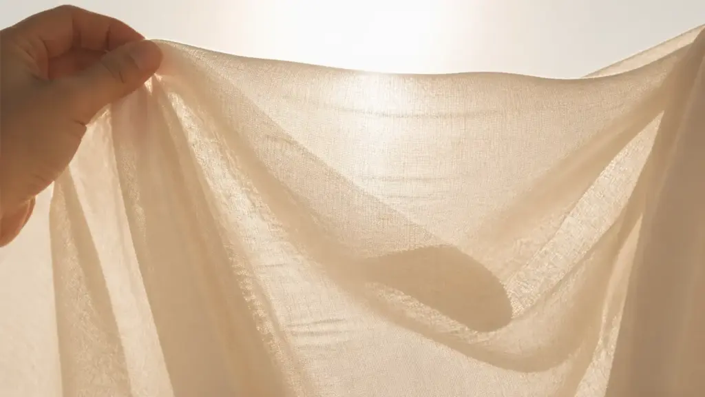 When viewed under light, viscose fabric reveals a loose fibrous structure and a semi-transparent quality.