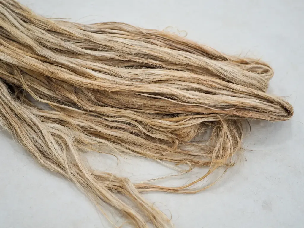 Visualizes the raw jute fiber stage, supporting the production process section.